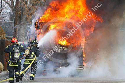 Firefighers putting out a motor home on fire in Boise, Idaho, USA.