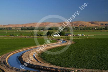 Farmland and irrigation canal near Vale, Oregon, USA.