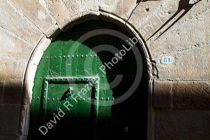 Arched door at Puente La Reina a Basque town along the Way of St. James pilgrimage route, Navarra, Spain.