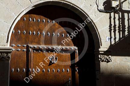 Arched door at Puente La Reina a Basque town along the Way of St. James pilgrimage route, Navarra, Spain.