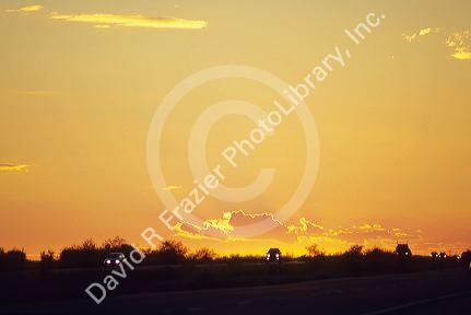 Cars with sunset on Interstate 8 in Arizona.