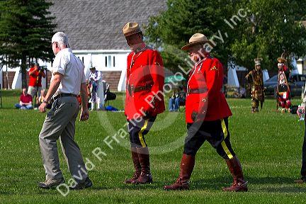 Royal Canadian Mounted Police wearing the Red Serge dress uniform at the Blackfoot Arts and Heritage Festival at Waterton Park townsite in Waterton Lakes National Park, Alberta, Canada.