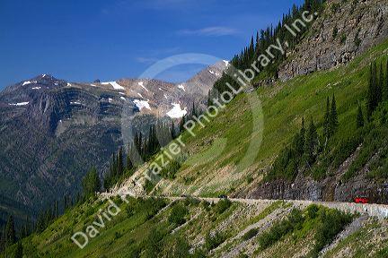 Red Jammer bus on the Going-to-the-Sun Road in Glacier National Park, Montana, USA.