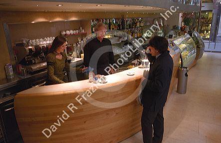A customer drinks coffee at a cafe in Italy.
