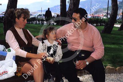 An Italian family having lunch in the park.