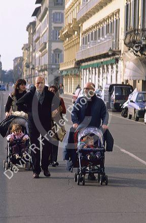 Italian families walking with their children.
