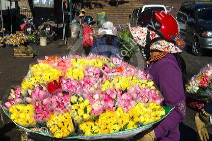 Street vendor selling roses in Da Lat, Vietnam.
