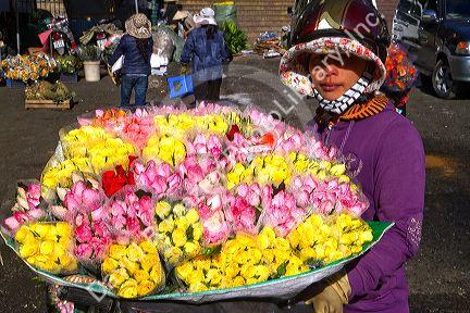 Street vendor selling roses in Da Lat, Vietnam.