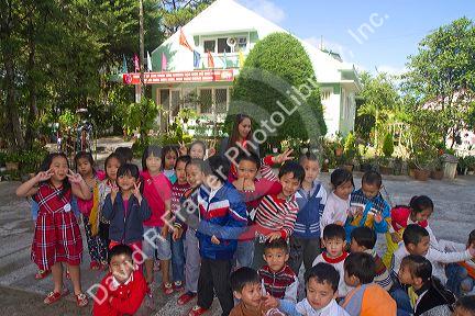 Young students outdoors at an elementary school in Da Lat, Vietnam.