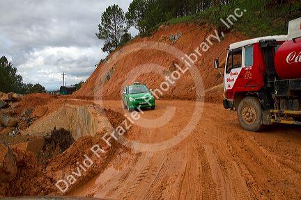 Road made of red clay at a construction site near Da Lat, Vietnam.