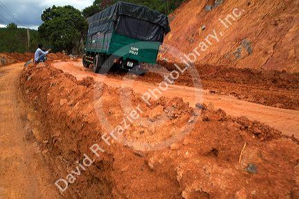 Road made of red clay at a construction site near Da Lat, Vietnam.