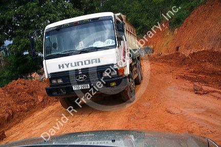 Road made of red clay at a construction site near Da Lat, Vietnam.