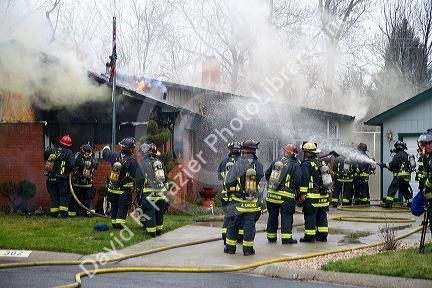 Firefighters respond to a house fire in Boise, Idaho, USA.