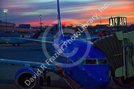 Sunrise over an airliner at Logan International Airport in East Boston, Massachusetts, USA.