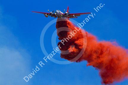 Lockheed P2V-5 Neptune Fire bomber dropping retardant on a wildfire in Idaho, USA.