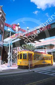 Trolley  street car in Ybor City, Tampa, Florida.  Movie theater in background.