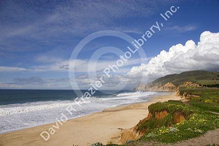 Waves and beach at Pacific City, California.