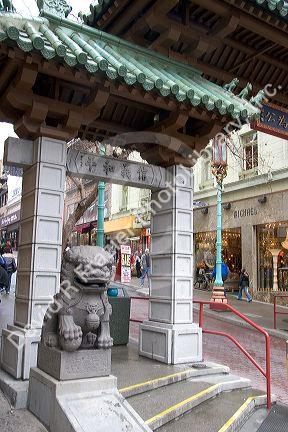 Stone figure of a dragon sits at the entrance to Chinatown, San Francisco, California.