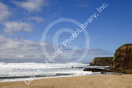Waves crash onto the beach in north of Santa Cruz, Califronia.