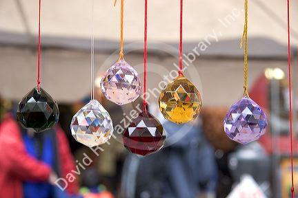 Prisims hang from a street vendors booth in Chinatown, San Francisco, California.