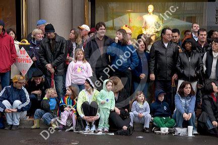 Crowds of people line up along the streets of Chinatown to watch the Chinese New Year Parade, San Francisco, California.