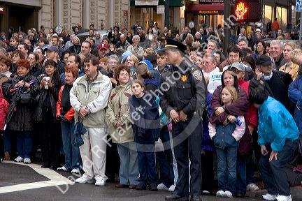 Crowds of people line up along the streets of Chinatown to watch the Chinese New Year Parade, San Francisco, California.