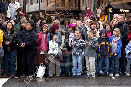 Crowds of people line up along the streets of Chinatown to watch the Chinese New Year Parade, San Francisco, California.