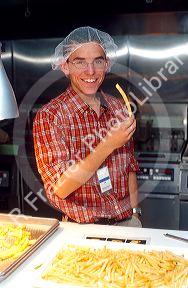 Quality control french fry tester at Idaho potato processing plant.