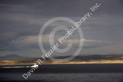 Coast Guard patrol boat returning to port at Monterey, California ahead of a storm.