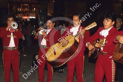 A mariachi band playing on the street in Mexico City, Mexico.