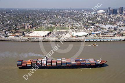 Container ship on the Mississippi River departing New Orleans, Louisiana.