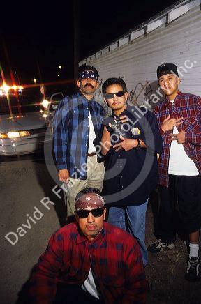 Hispanic gang members showing gang signs in Caldwell, Idaho.