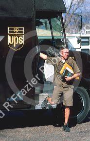 UPS Delivery person with digital electronic signature computer.  MR