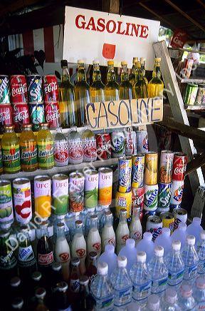 Beverages and gasoline being sold at a stand in Thailand.