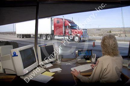 Weigh master at truck scales near Boise, Idaho.