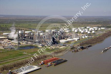 Aerial of refinery and tug boats along the Mississippi River near New Orleans, Louisiana.