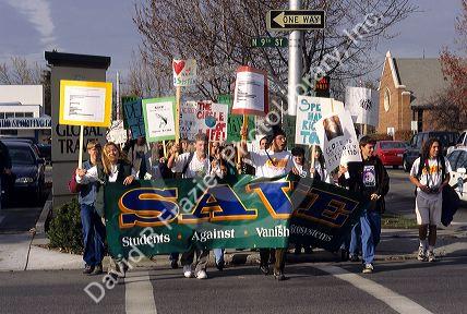 Students stage a demonstration Against Vanishing Ecosystems.