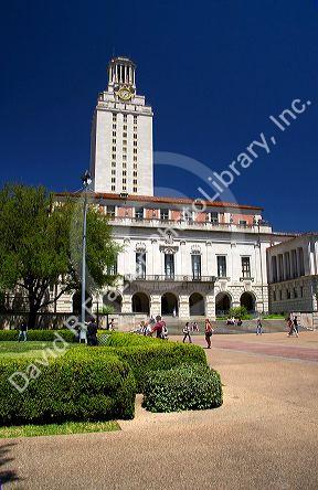 Students on the campus of University of Texas in Austin near the clock tower.