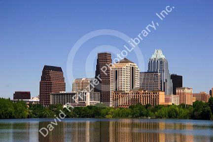 Cityscape skyline view of Austin, Texas with City Lake in the foreground.