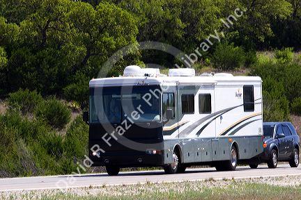 A recreational vehicle pulling a car on Interstate 10 in west Texas.