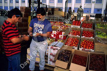 Customer shops at a wholesale fruit and vegetable market in Los Angeles, California.