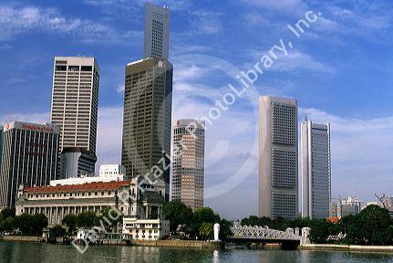 Modern buildings in Singapore contrast with older structures.