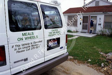 A volunteer delivers food from Meals on Wheels in Boise, Idaho.