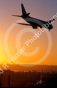 Boeing 737 landing in San Diego, California at sunset.