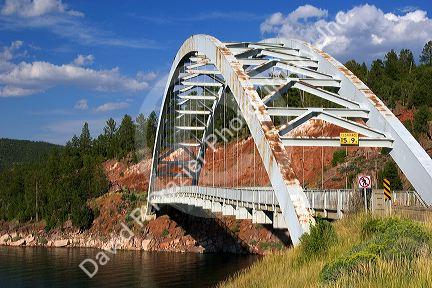 Arched iron suspension bridge along highway U.S. 191 at Flaming Gorge National Recreation Area in Utah.