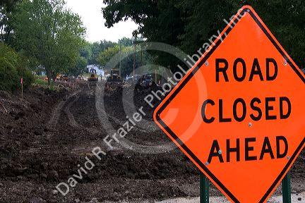 Road closed ahead sign due to sewer work being done in Oceola, Iowa.