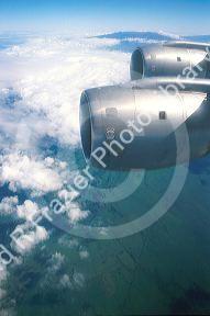 Passenger view of  jet engines and clouds.