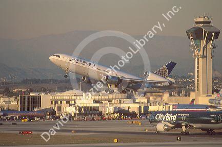 LAX airport in Los Angeles, California with DC-10 taking off.