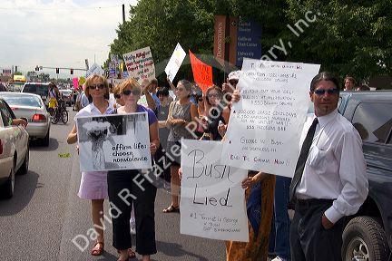 People holding signs at an Anti-war protest in Salt Lake City, Utah. 8/22/2005