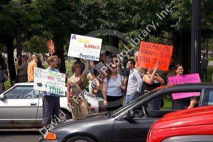 People holding signs at an Anti-war protest in Salt Lake City, Utah. 8/22/2005